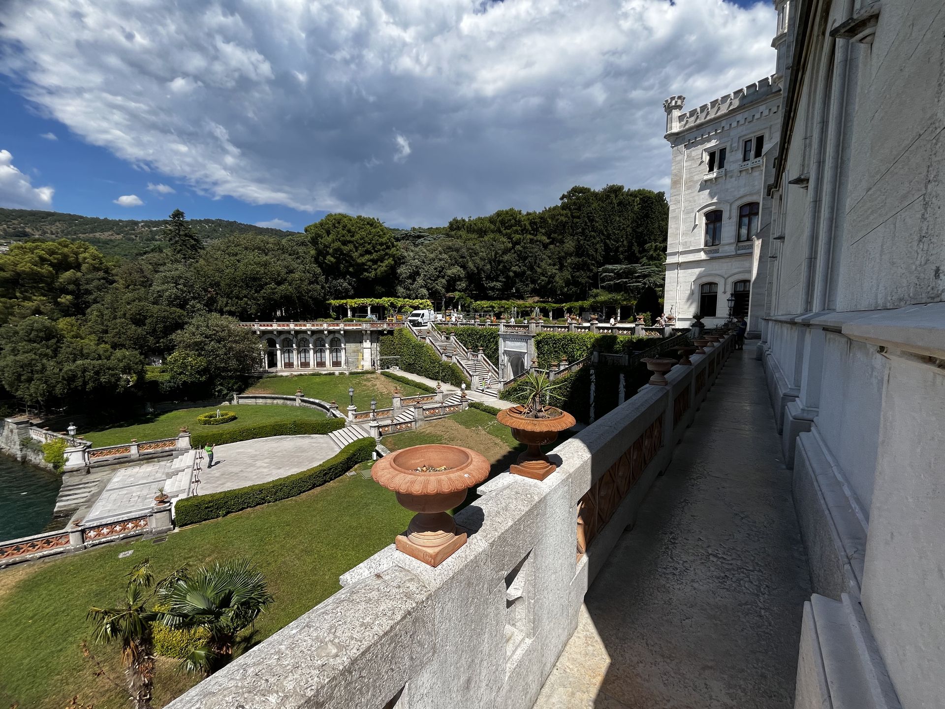 castle garden with marble steps leading to it by the miramare castle