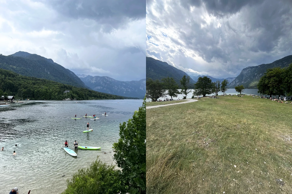 Lake bohinj with people on paddleboards and people lying around in the shade